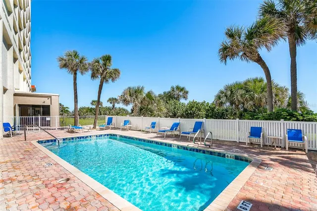 a view of a swimming pool with a patio