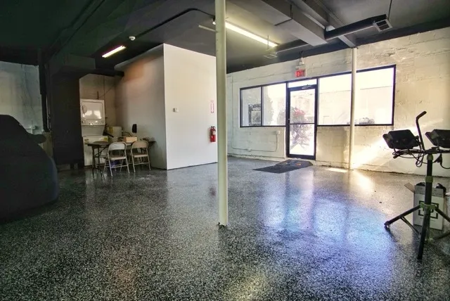a view of a lobby with furniture and floor to ceiling window