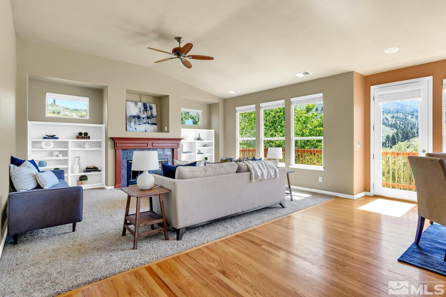 4965 Pinebluff Trail Reno, NV 89519 - Photo 12 of 40 a living room with furniture and a fireplace