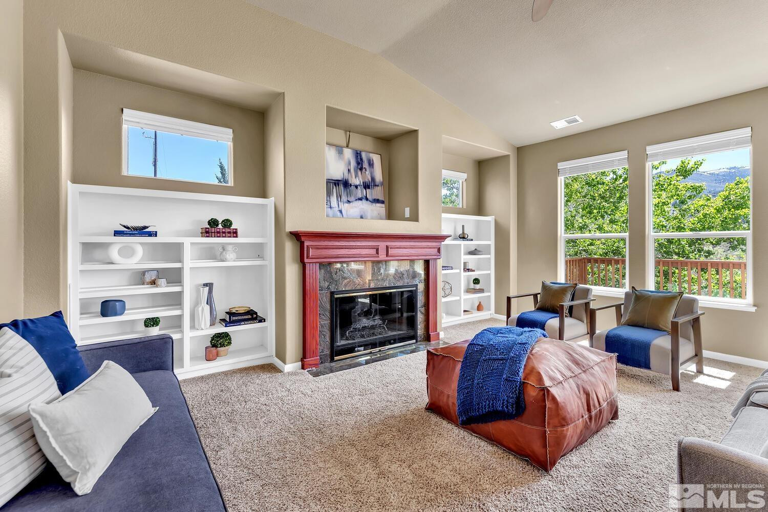 4965 Pinebluff Trail Reno, NV 89519 - Photo 13 of 40 a living room with furniture and a fireplace