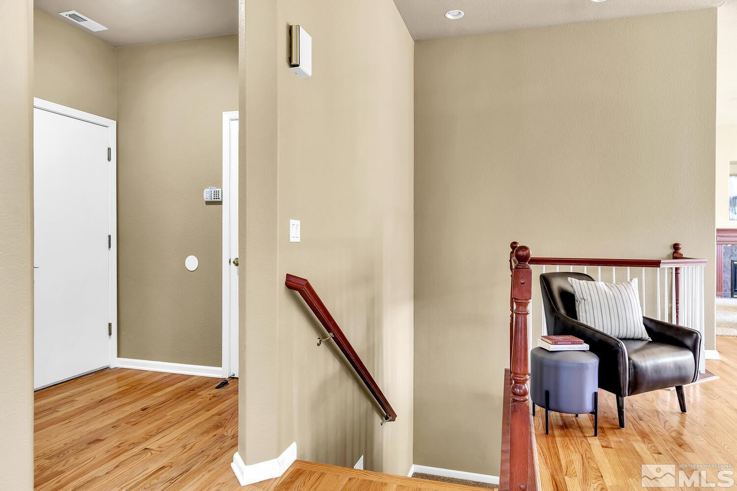 4965 Pinebluff Trail Reno, NV 89519 - Photo 20 of 40 a view of a hallway with furniture and wooden floor