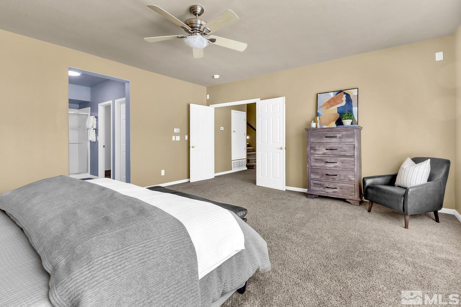4965 Pinebluff Trail Reno, NV 89519 - Photo 26 of 40 a spacious bedroom with a bed and furniture