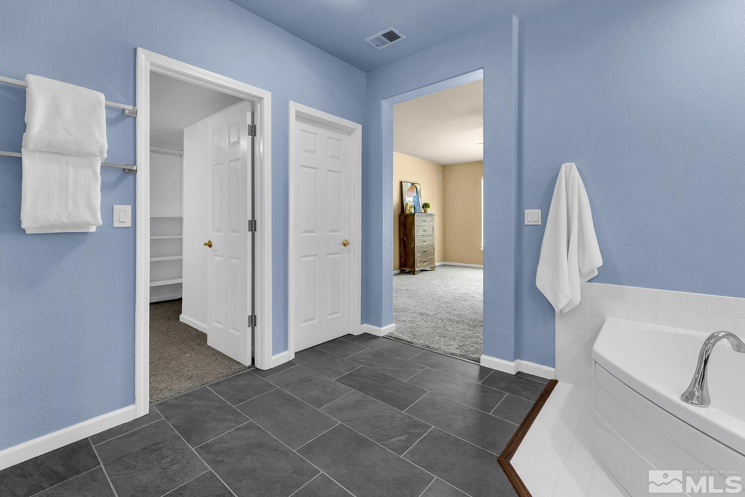 4965 Pinebluff Trail Reno, NV 89519 - Photo 29 of 40 a view of a bathroom from a hallway