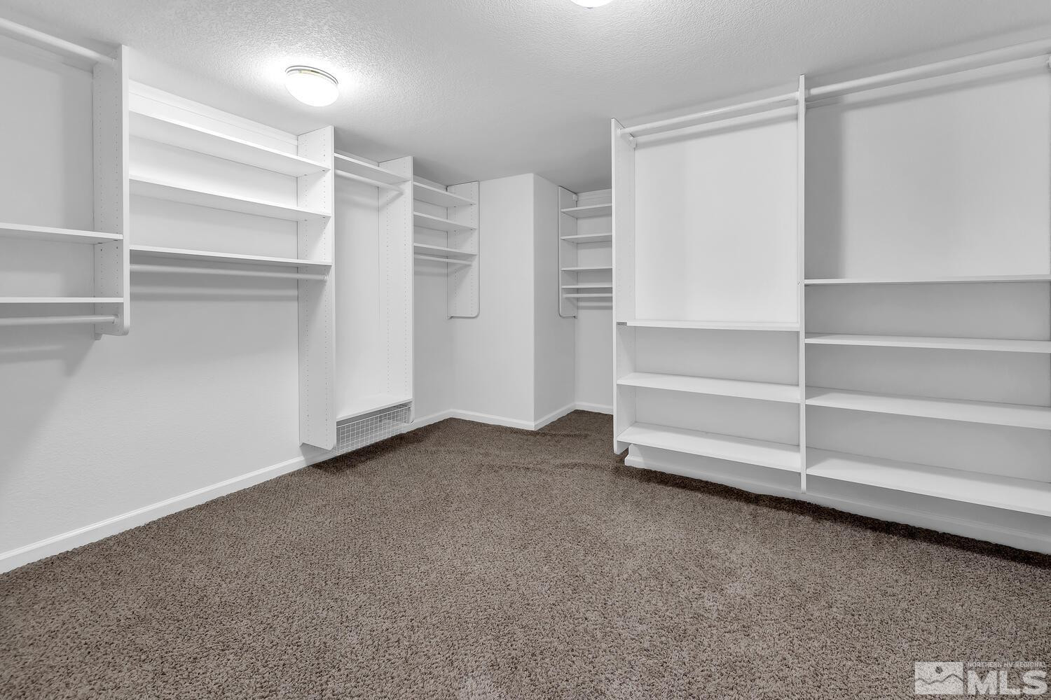 4965 Pinebluff Trail Reno, NV 89519 - Photo 31 of 40 a view of walk in closet with empty racks