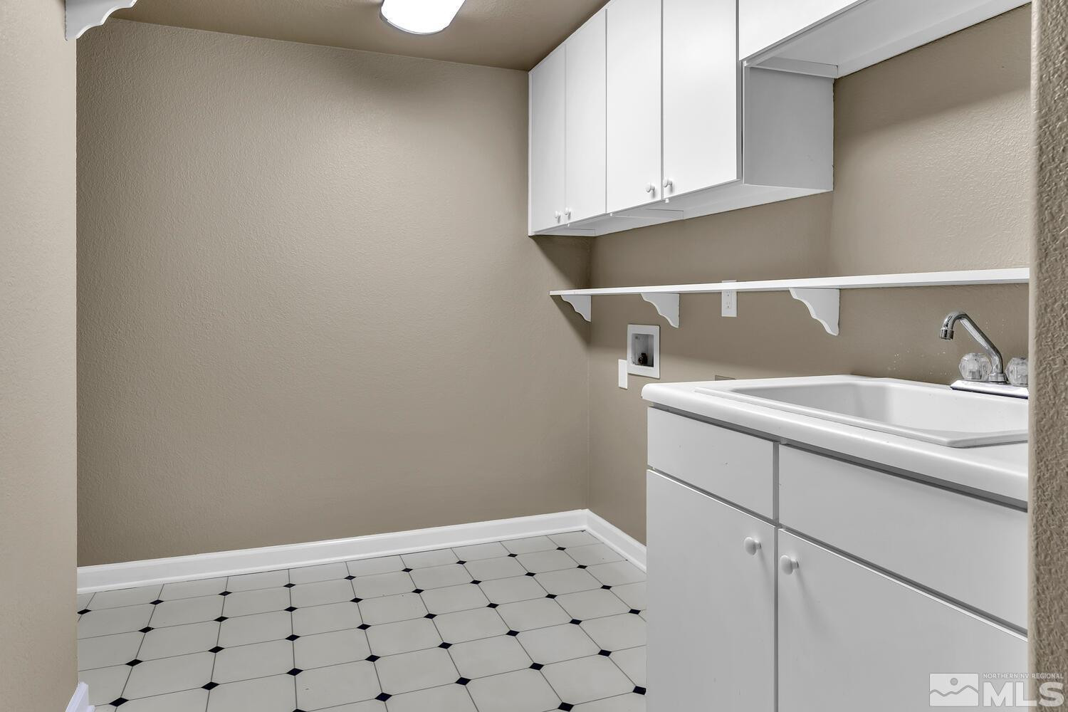 4965 Pinebluff Trail Reno, NV 89519 - Photo 35 of 40 a bathroom with a sink and a mirror