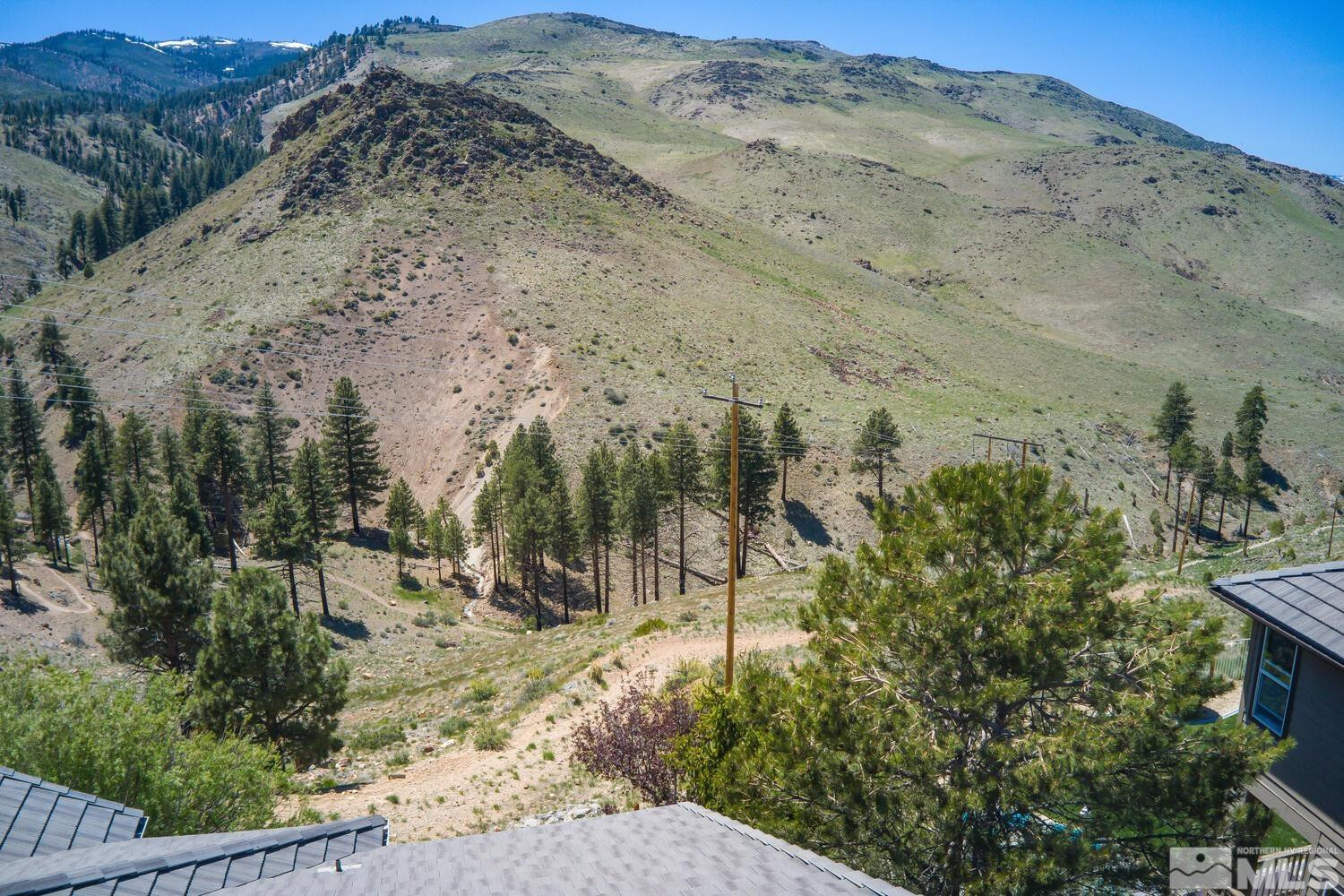 4965 Pinebluff Trail Reno, NV 89519 - Photo 37 of 40 a view of a road with mountains in the background