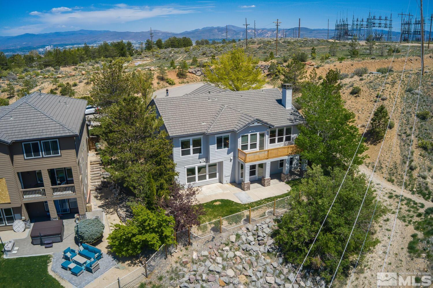 4965 Pinebluff Trail Reno, NV 89519 - Photo 38 of 40 an aerial view of a house with a garden and lake view