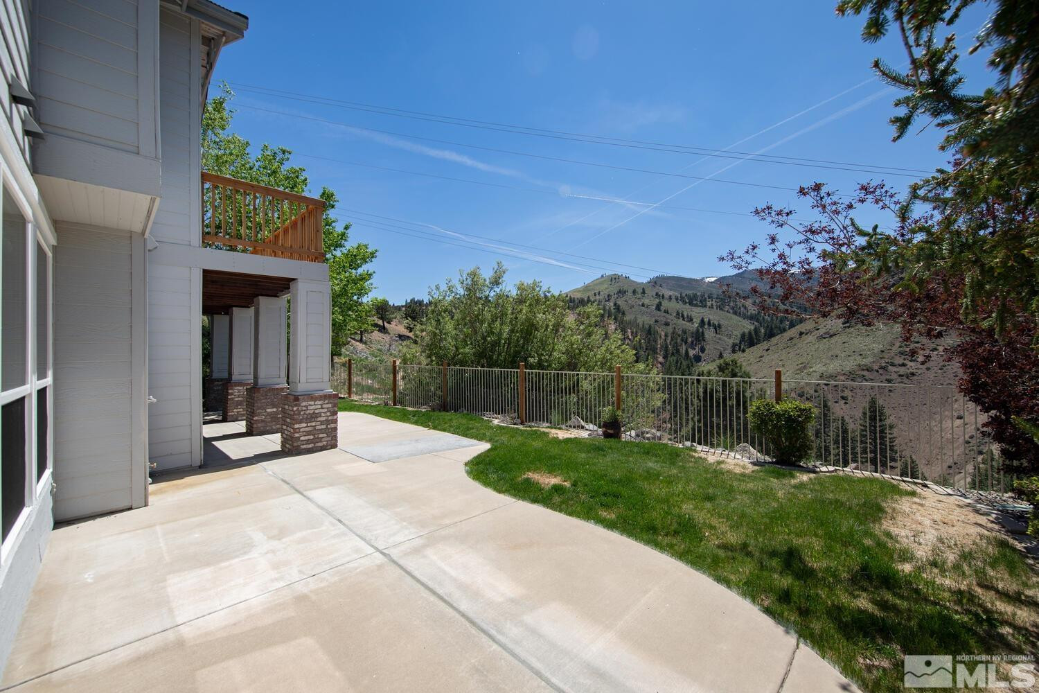 4965 Pinebluff Trail Reno, NV 89519 - Photo 39 of 40 a view of a backyard with a garden and tree