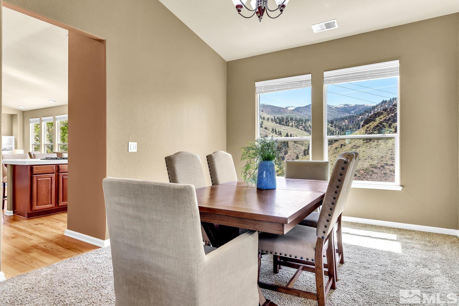 4965 Pinebluff Trail Reno, NV 89519 - Photo 7 of 40 a view of a dining room with furniture and a window