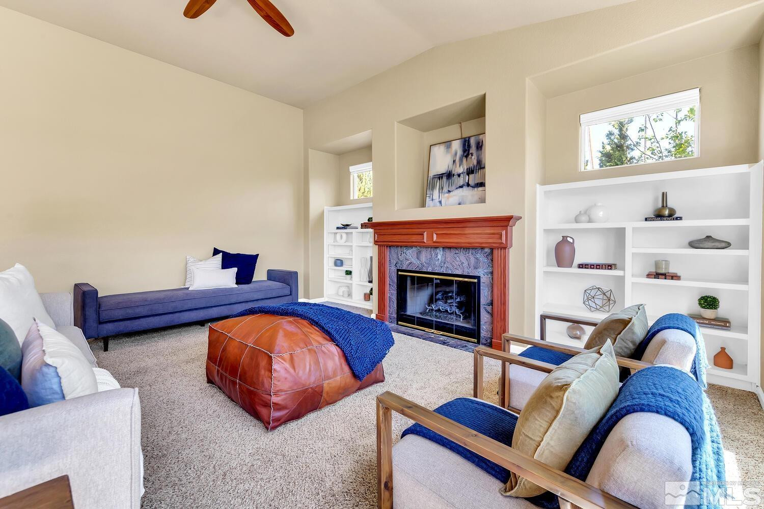 4965 Pinebluff Trail Reno, NV 89519 - Photo 10 of 40 a living room with furniture and a fireplace