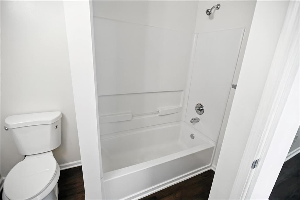 2537 Walden Lake Drive Decatur, GA 30035 - Photo 12 of 22 a bathroom with a toilet and a bathtub