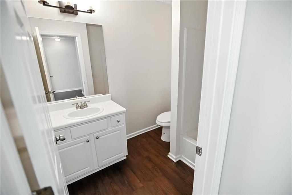 2537 Walden Lake Drive Decatur, GA 30035 - Photo 13 of 22 a bathroom with a sink a toilet and a mirror