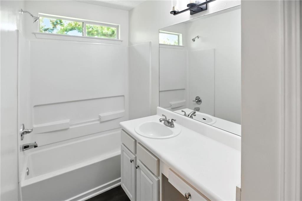 2537 Walden Lake Drive Decatur, GA 30035 - Photo 14 of 22 a bathroom with a sink a toilet and shower