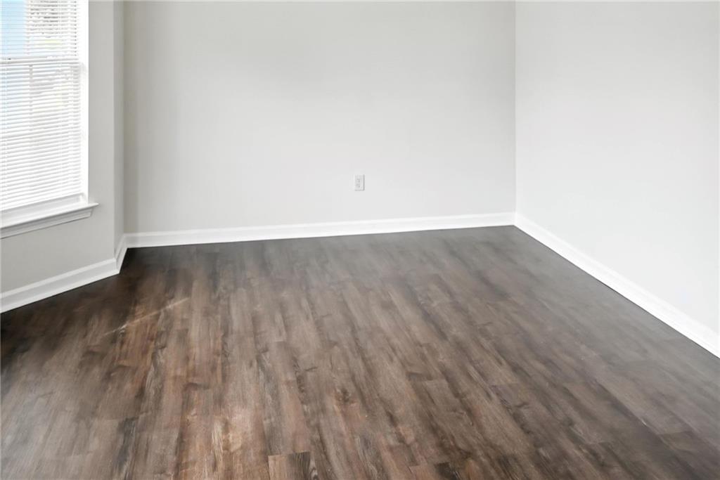 2537 Walden Lake Drive Decatur, GA 30035 - Photo 15 of 22 an empty room with wooden floor and windows