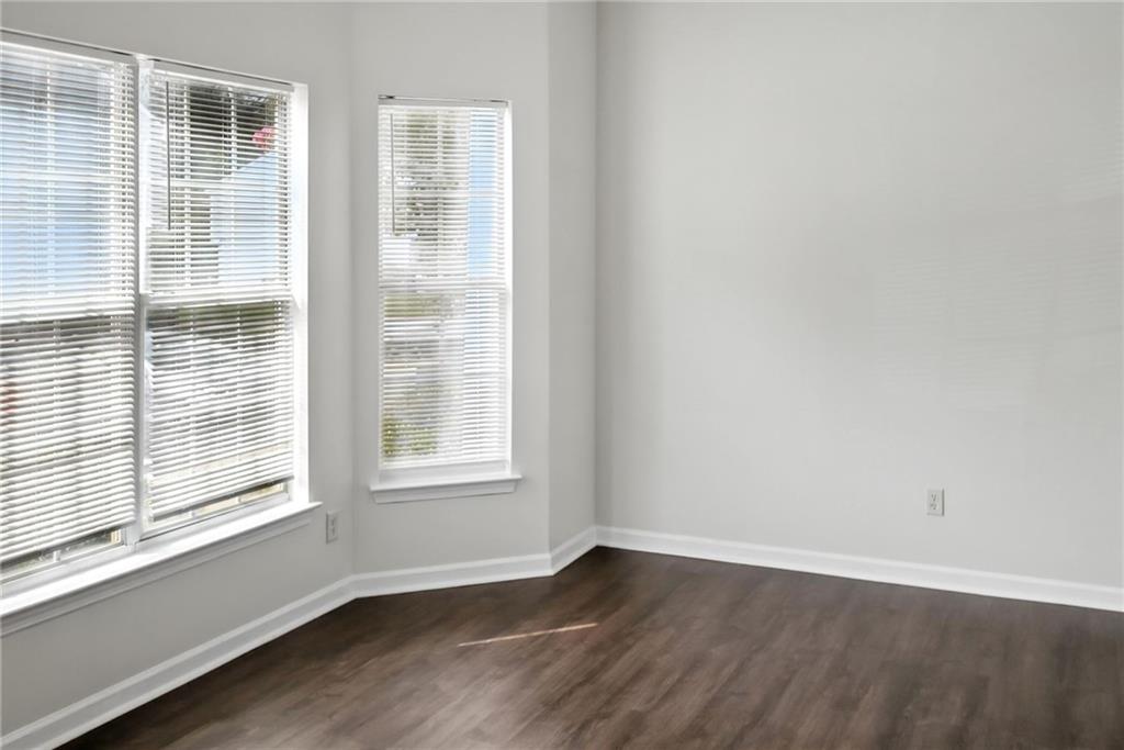 2537 Walden Lake Drive Decatur, GA 30035 - Photo 16 of 22 an empty room with wooden floor and windows