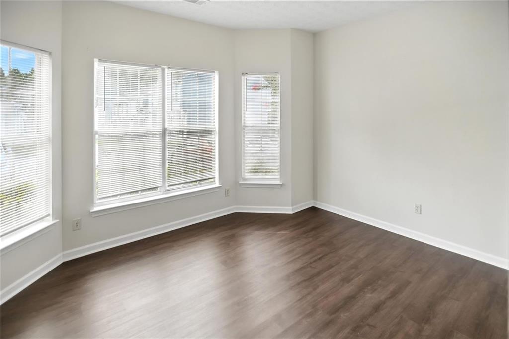 2537 Walden Lake Drive Decatur, GA 30035 - Photo 17 of 22 an empty room with wooden floor and windows