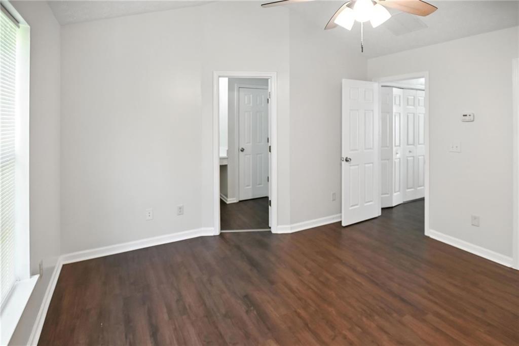 2537 Walden Lake Drive Decatur, GA 30035 - Photo 21 of 22 an empty room with wooden floor and windows