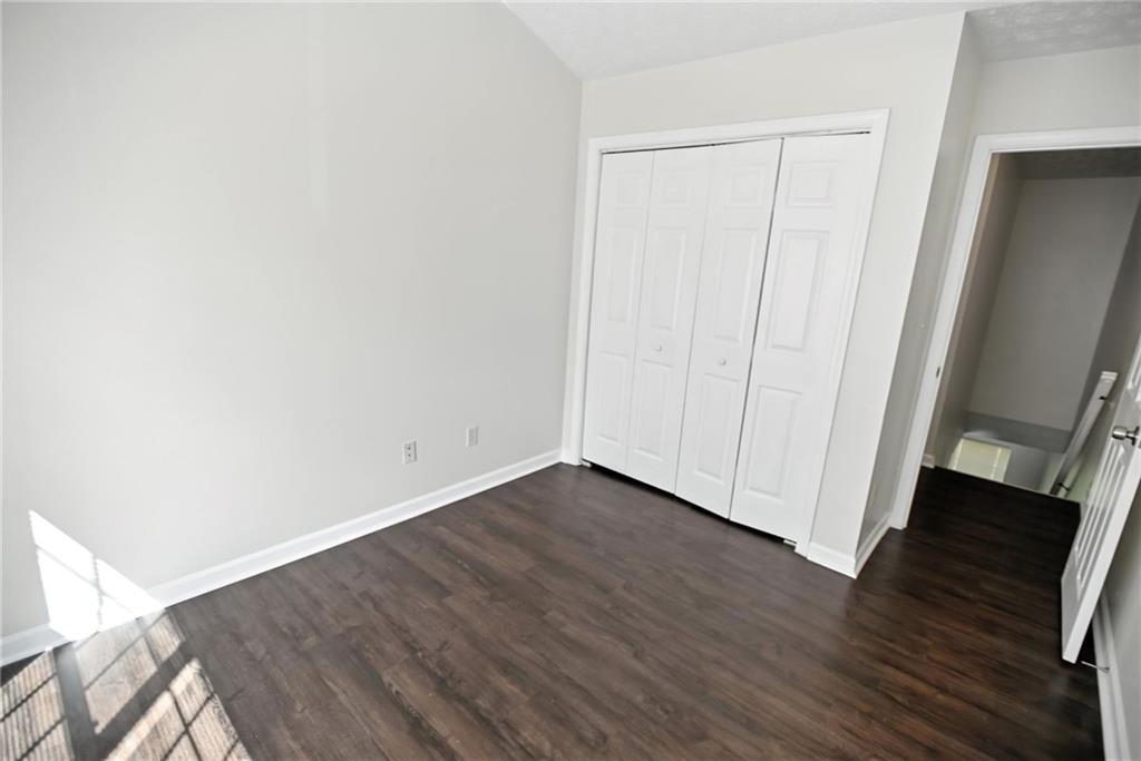 2537 Walden Lake Drive Decatur, GA 30035 - Photo 8 of 22 a view of an empty room with wooden floor