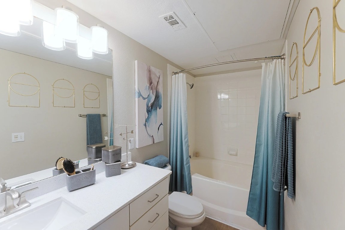 10505 South I-35 Frontage Road, Unit 338 Austin, TX 78747 - Photo 13 of 20 Bathroom featuring vanity and shower / bath combo