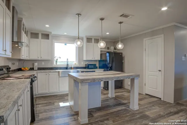 a view of a kitchen and center island