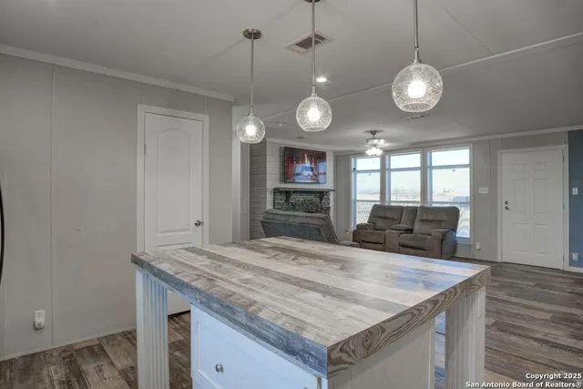 a view of living room with granite countertop furniture and lamp