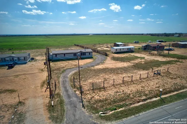 a view of a terrace with a big yard