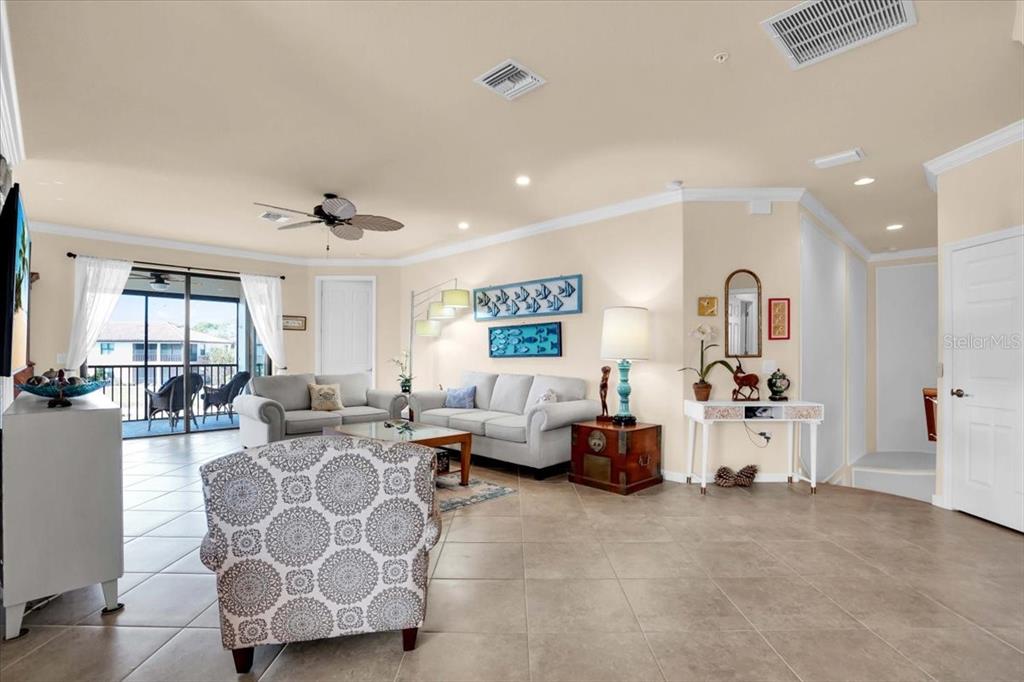 20201 Ragazza Circle, Unit 201 Venice, FL 34293 - Photo 17 of 58 a living room with furniture and a large window