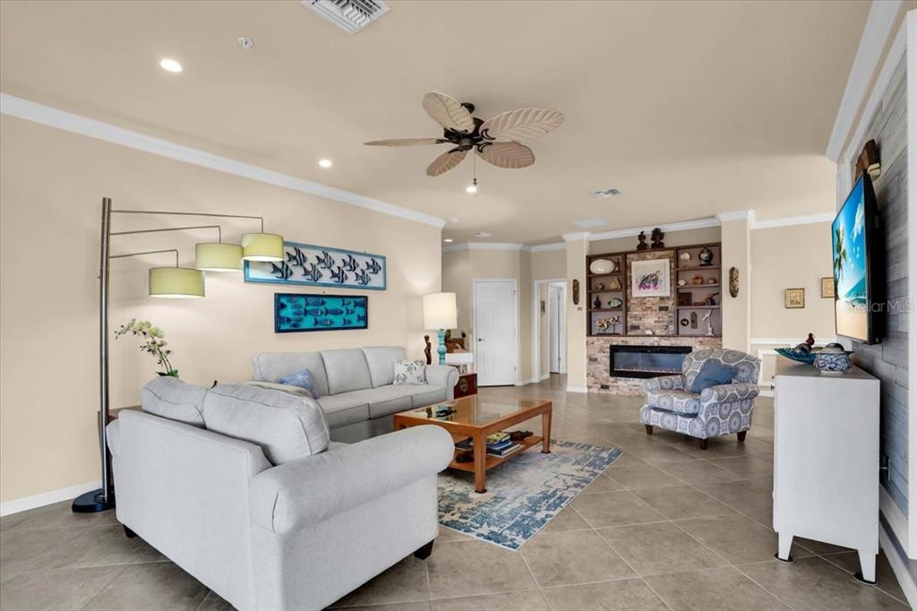 20201 Ragazza Circle, Unit 201 Venice, FL 34293 - Photo 18 of 58 a living room with furniture and a ceiling fan