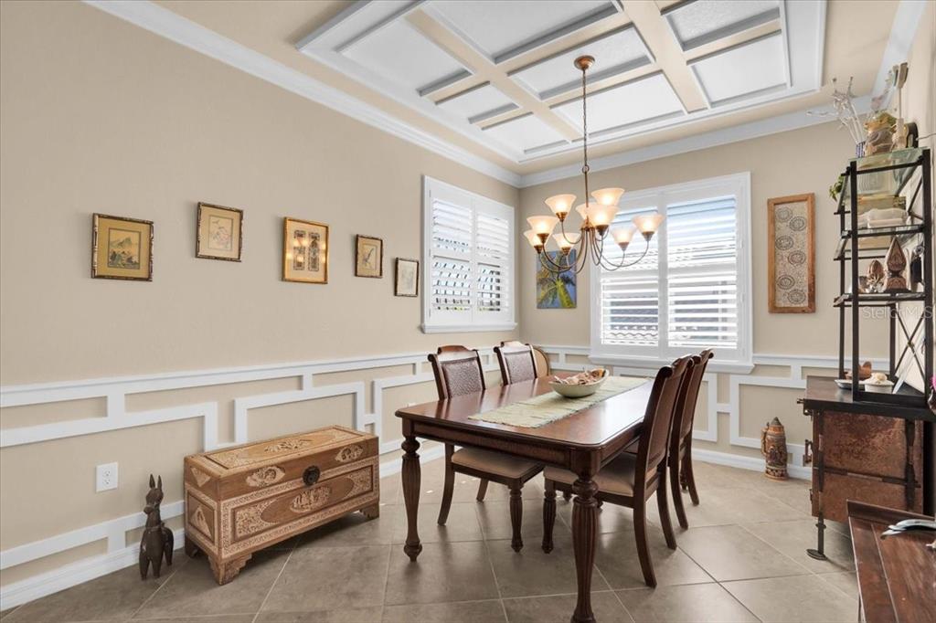 20201 Ragazza Circle, Unit 201 Venice, FL 34293 - Photo 19 of 58 a dining room with furniture and window