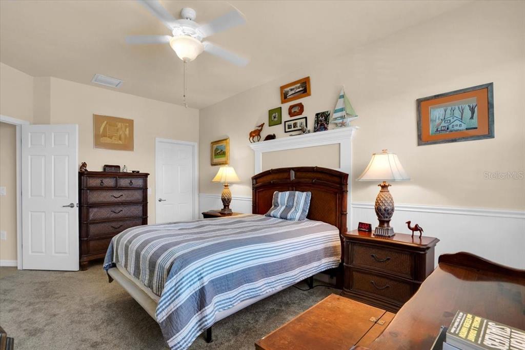 20201 Ragazza Circle, Unit 201 Venice, FL 34293 - Photo 38 of 58 a bedroom with a bed and dresser