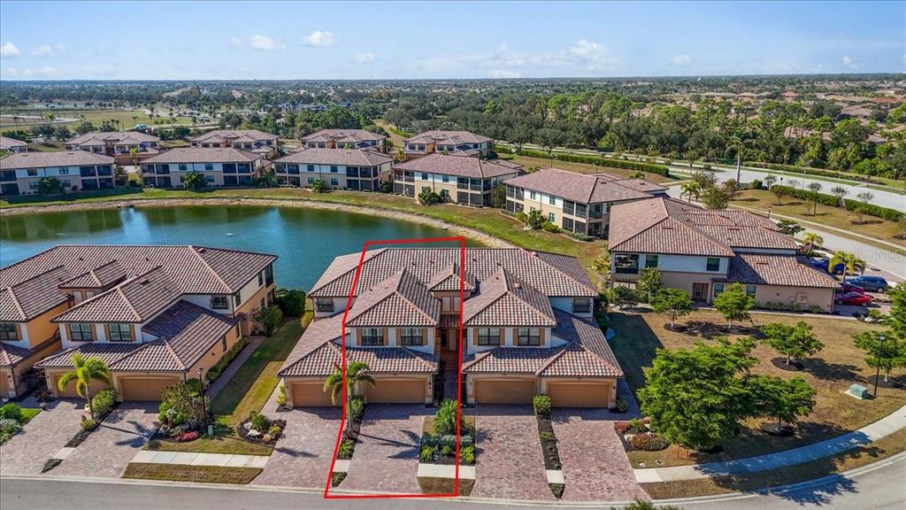 20201 Ragazza Circle, Unit 201 Venice, FL 34293 - Photo 5 of 58 an aerial view of a house with a lake view