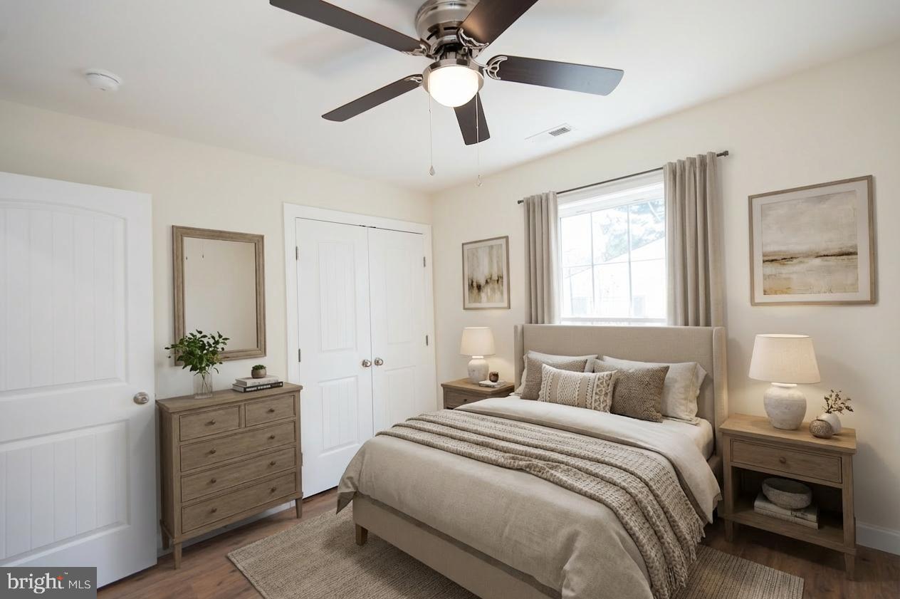 406 Charles Street Hurlock, MD 21643 - Photo 12 of 17 a bedroom with a bed and a window
