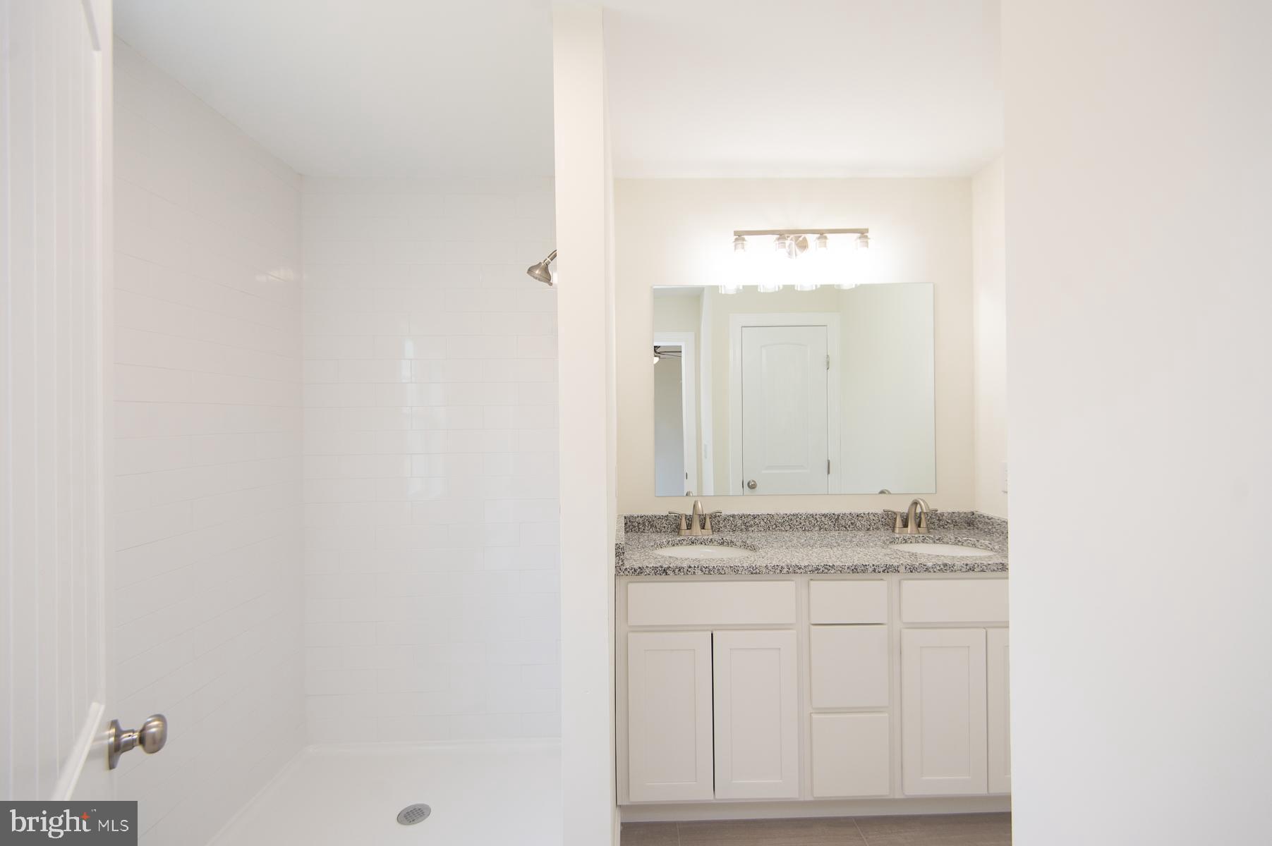 406 Charles Street Hurlock, MD 21643 - Photo 15 of 17 a bathroom with a sink and a mirror