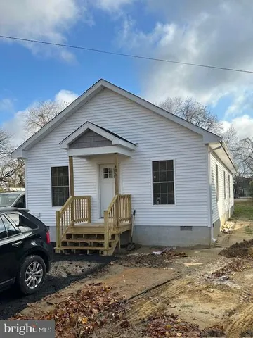 a front view of a house with parking space