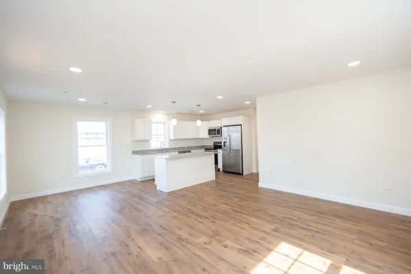a view of kitchen with wooden floor