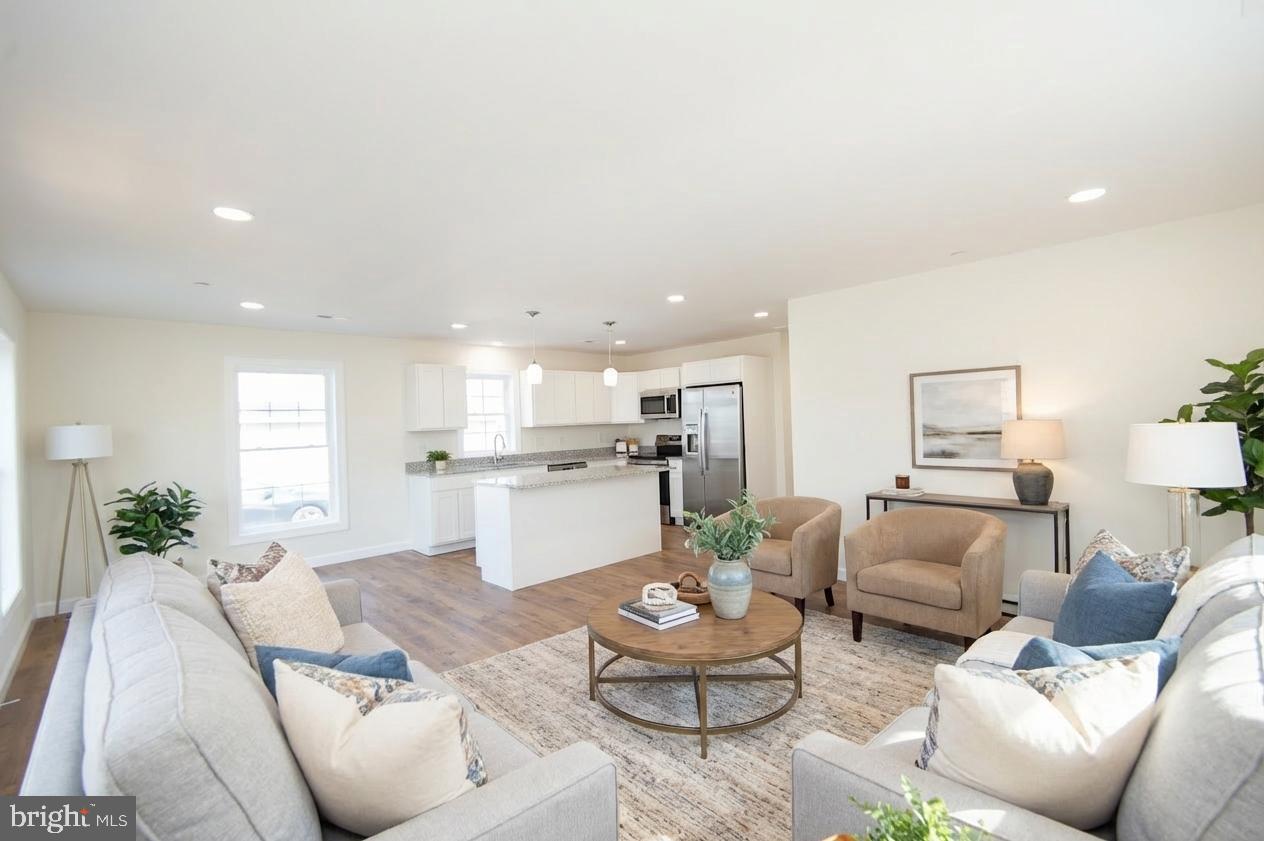 406 Charles Street Hurlock, MD 21643 - Photo 4 of 17 a living room with furniture and view of kitchen