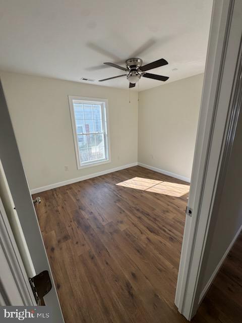 406 Charles Street Hurlock, MD 21643 - Photo 7 of 8 a view of an empty room with a window