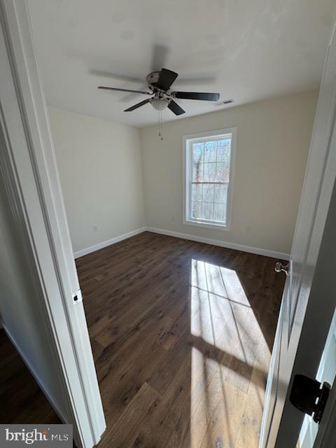 406 Charles Street Hurlock, MD 21643 - Photo 8 of 8 a view of an empty room and wooden floor