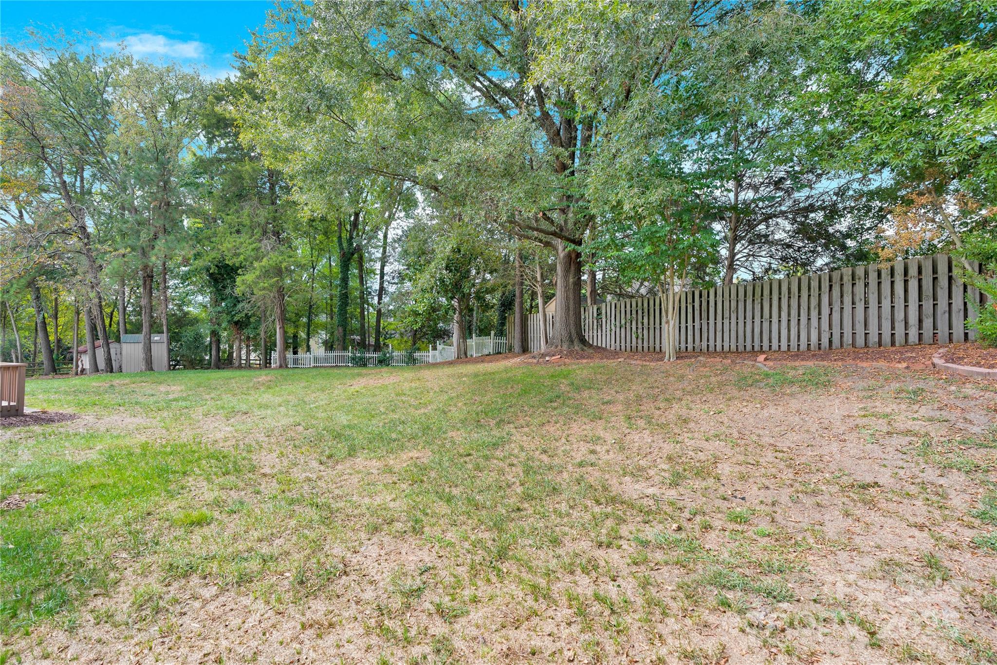 2848 Ridge Crossing Court Northwest Concord, NC 28027 - Photo 11 of 37 a backyard of a house with lots of green space