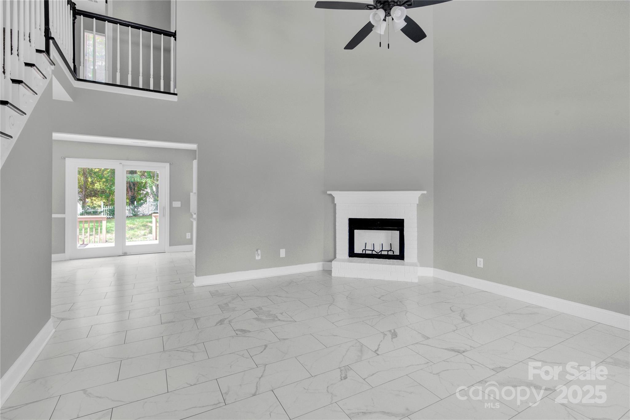 2848 Ridge Crossing Court Northwest Concord, NC 28027 - Photo 22 of 37 an empty room with windows and fireplace