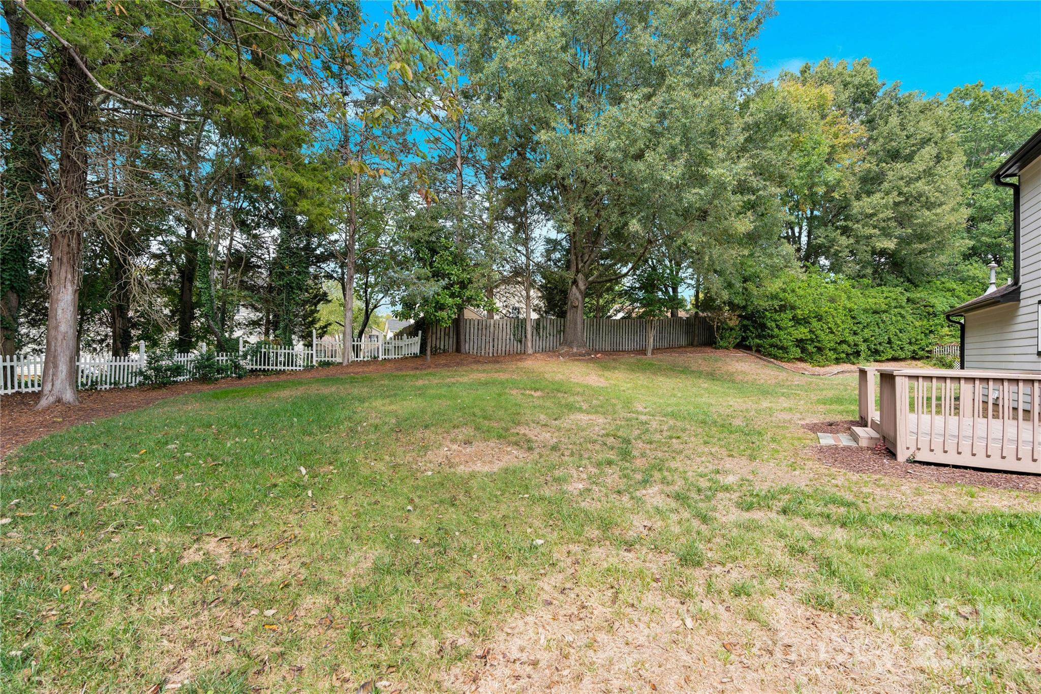 2848 Ridge Crossing Court Northwest Concord, NC 28027 - Photo 5 of 37 a view of a garden with wooden fence