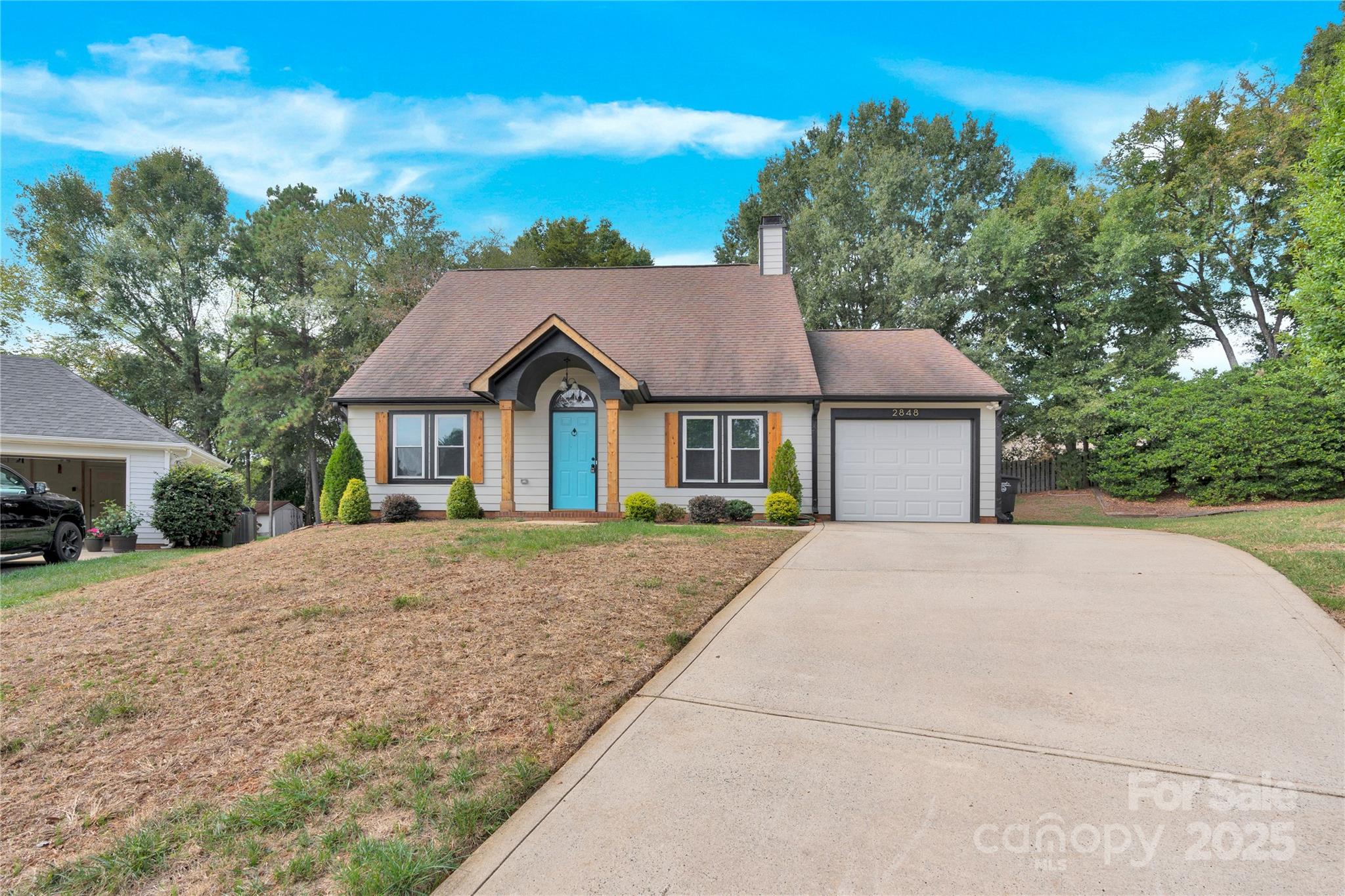 2848 Ridge Crossing Court Northwest Concord, NC 28027 - Photo 10 of 37 a front view of a house with a yard and garage