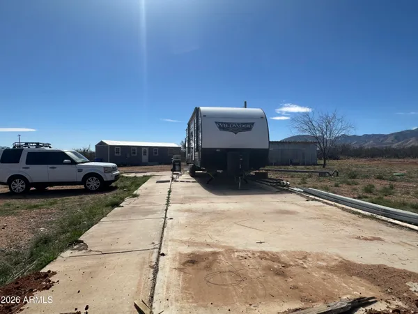 a view of a car parked on the side of the road