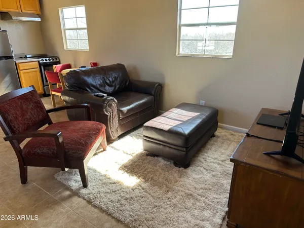 a living room with furniture and a window