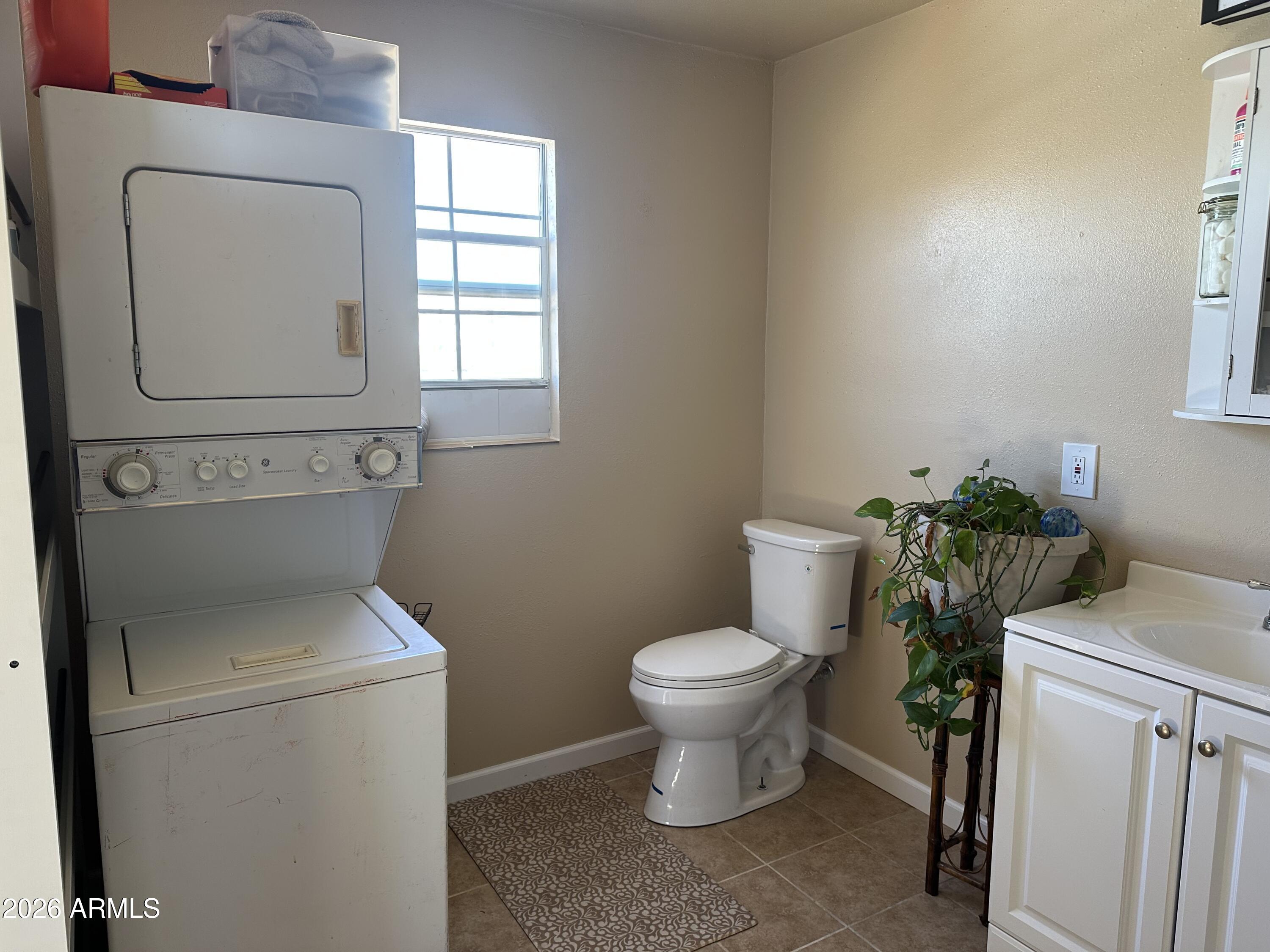 5778 South Kino Road Hereford, AZ 85615 - Photo 8 of 18 a bathroom with a toilet and a sink