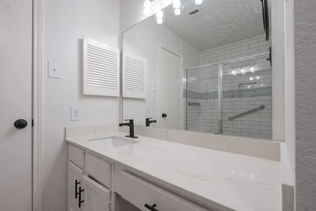 a bathroom with a sink and a bathtub