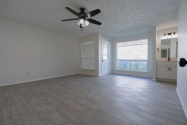 a bathroom with double vanity sinks a vanity and a mirror