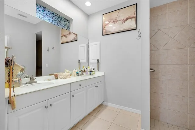 an aerial view of a house with garden space and lake view