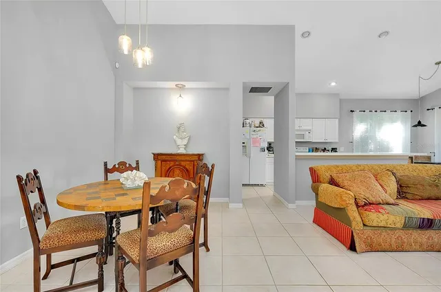 a view of a house with backyard porch and sitting area