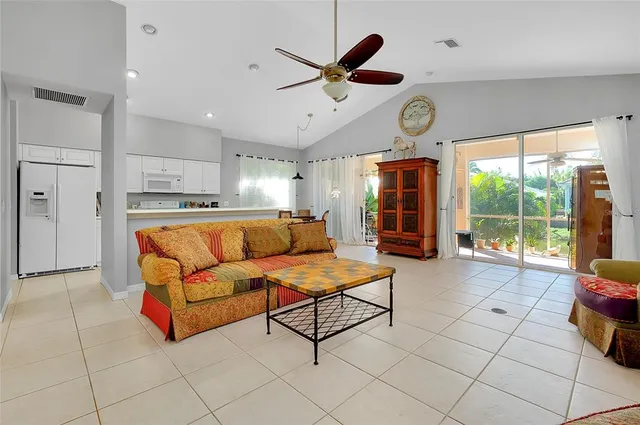 a front view of a house with a garden and plants